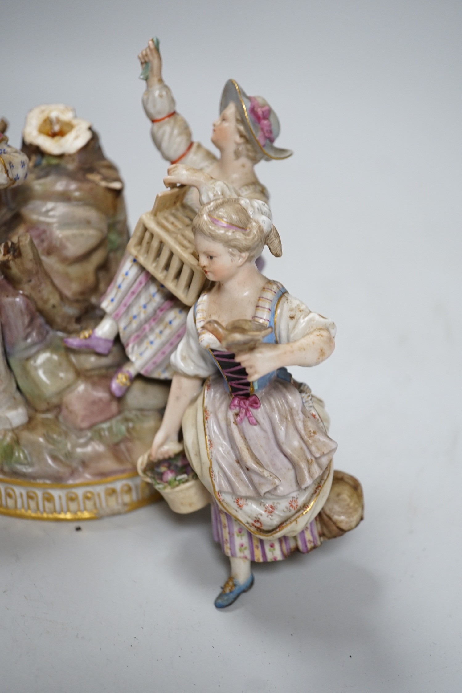 A Meissen group of flower pickers with bird cage, model F94 (a.f.)